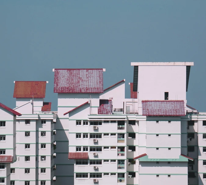 a large white building with a red roof, inspired by Zhang Kechun, pexels contest winner, brutalism, singapore ( 2 0 1 8 ), soviet apartment buildings, buildings photorealism, 1980s photo