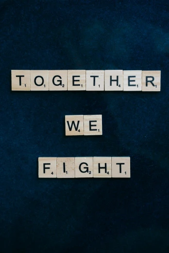 scrabbles spelling together we fight on a blue background, an album cover, unsplash, fighter, 2 5 6 x 2 5 6 pixels, on, 8