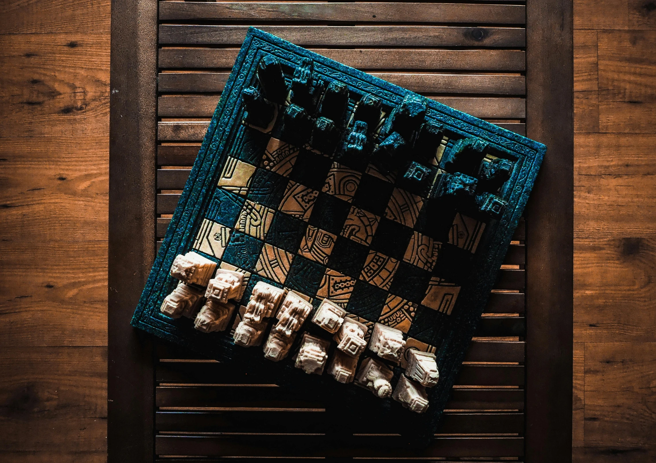 a christmas stocking sitting on top of a wooden table, an album cover, by Carey Morris, unsplash contest winner, chess set, carved from sapphire stone, brown and cyan color scheme, 🦩🪐🐞👩🏻🦳