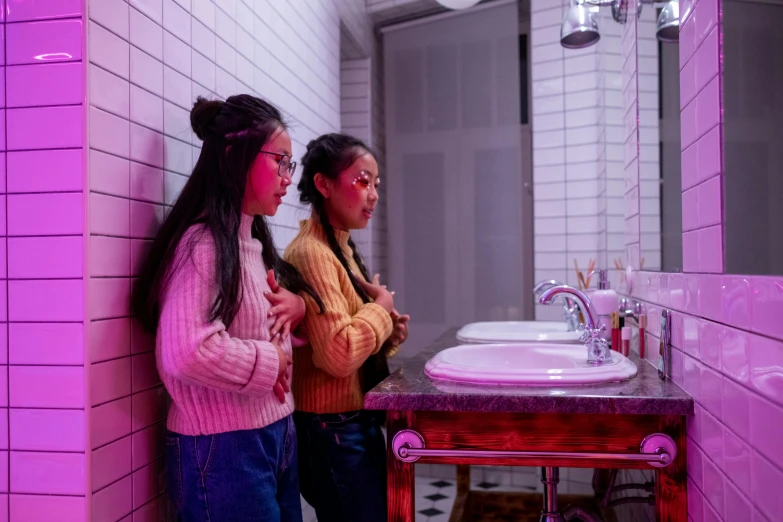 a couple of women standing next to a bathroom sink, by Gina Pellón, trending on unsplash, happening, soft neon purple lighting, ruan jia and fenghua zhong, high school girls, performance