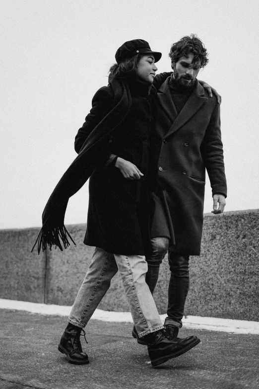 a black and white photo of two people walking, pexels contest winner, antipodeans, ( ( wearing a long coat ) ), lovers, ffffound, mc escher and ronny khalil