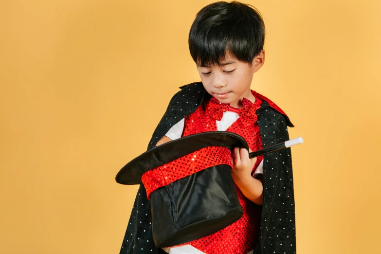 a little boy dressed up in a costume, pexels, magic realism, female magician, rectangle, school curriculum expert, hiro