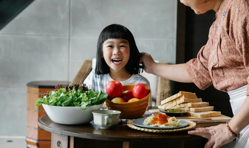 a woman standing next to a little girl at a table, pexels contest winner, salad, japanese collection product, happy kid, profile image