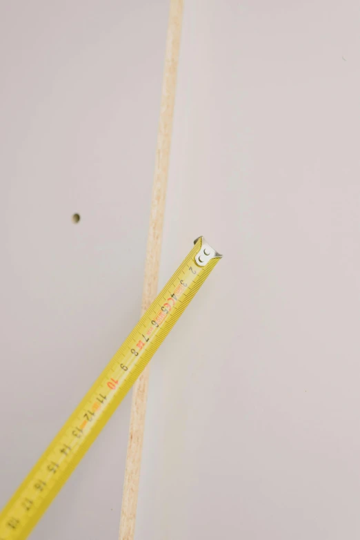 a ruler sitting on top of a piece of paper, very tall ceilings, sunken recessed indented spots, suspended ceiling, 3/4 view from below
