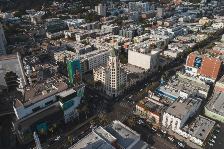 an aerial view of a city with tall buildings, by Meredith Dillman, unsplash contest winner, art nouveau, hollywood scene, square, thumbnail, high quality photo