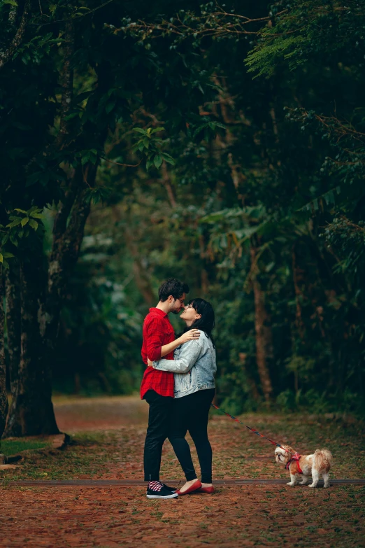 a couple kissing in the woods with their dog, pexels contest winner, in a jungle environment, te pae, blank, on ground