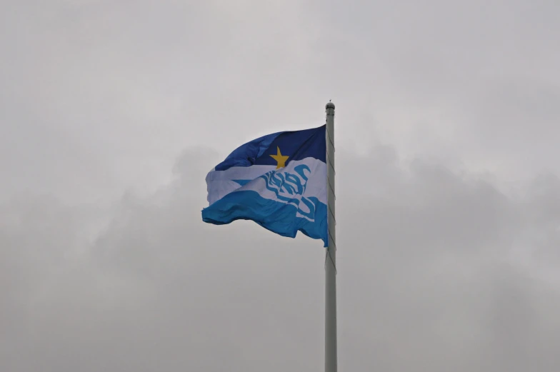 a blue and white flag flying in the sky, hestiasula head, square, low quality photo, staff
