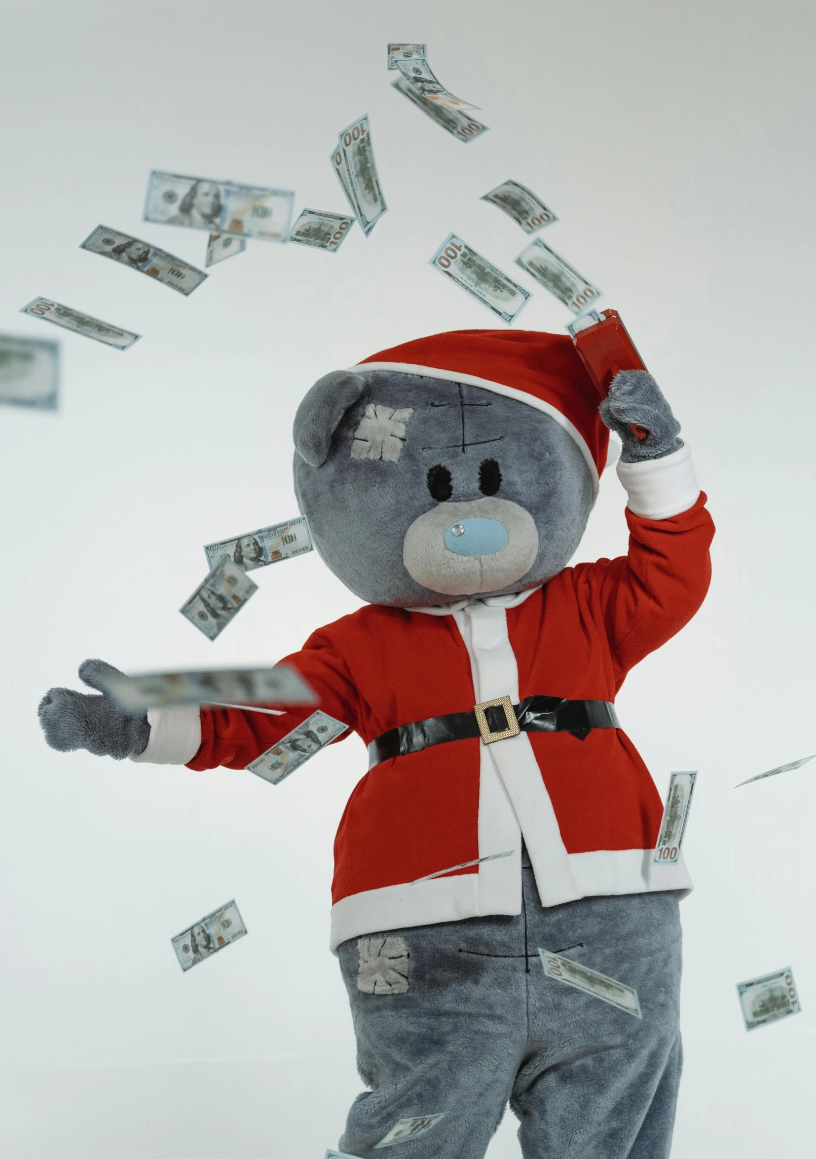 a teddy bear dressed as santa claus throwing money, reddit contest winner, conceptual art, promo image, wearing a grey fur robe, in 4k, 64x64