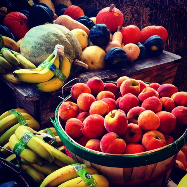 a table filled with lots of different types of fruit, instagram photo, cart, harvest fall vibrancy, bananas