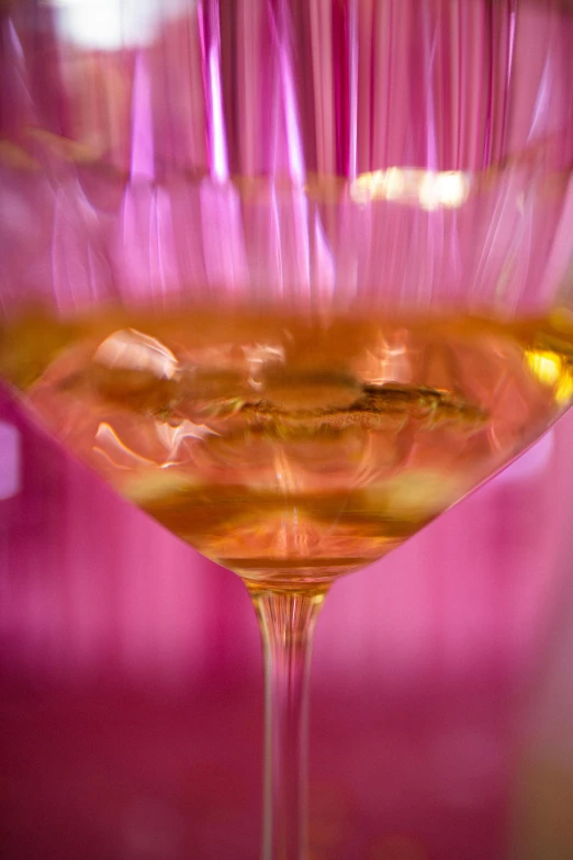 a glass of wine sitting on top of a table, by Jan Rustem, flowing pink-colored silk, macro focus, complexly detailed, mead