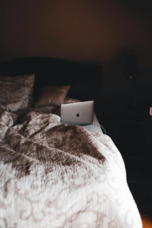 a bed with a laptop sitting on top of it, inspired by Elsa Bleda, unsplash, cinematic. ”, brown, romantic lead, college