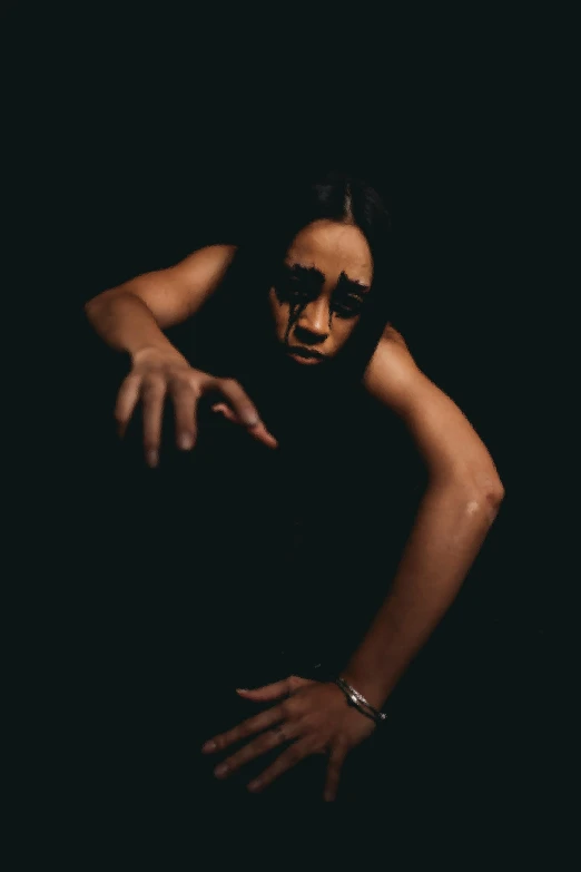a woman reaching for something in the dark, an album cover, intimidating pose, tessa thompson inspired, extreme face contortion, taken in the early 2020s
