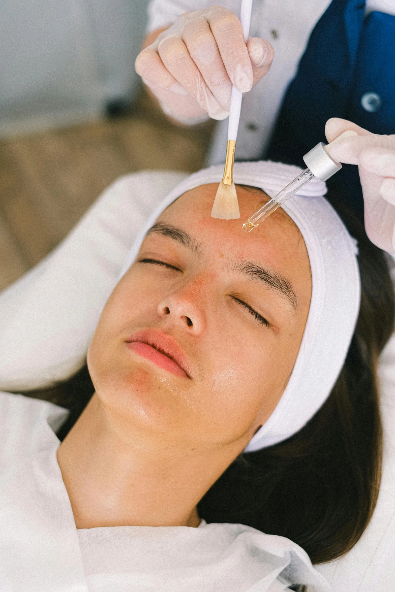 a woman getting a facial treatment in a beauty salon, by Julia Pishtar, sweaty skin dripping down face, face accessories, thumbnail, masking