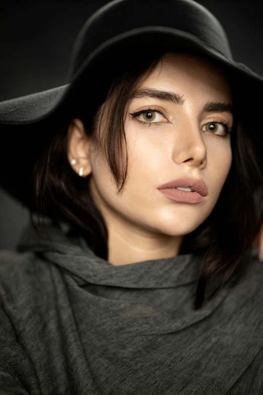 a close up of a person wearing a hat, a character portrait, by irakli nadar, trending on pexels, ana de armas portrait, beautiful iranian woman, attractive androgynous humanoid, grey