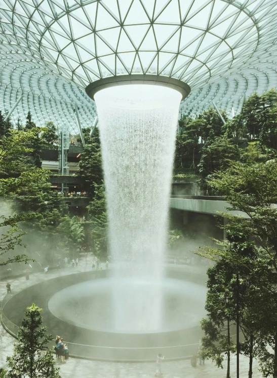 the inside of a building with a waterfall coming out of it, inspired by Cheng Jiasui, pexels contest winner, hyperrealism, cloud forest, norman foster, avatar image, singapore esplanade
