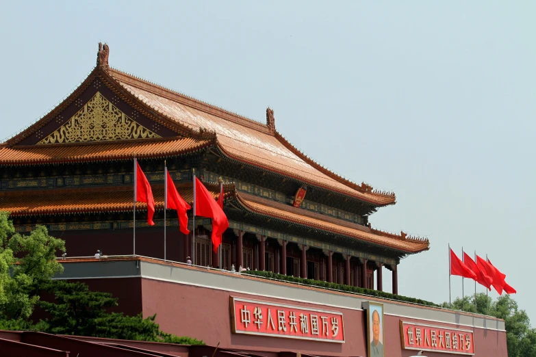 a building with red flags in front of it, inspired by Wang Yi, pexels contest winner, cloisonnism, square, tiananmen square, avatar image, red roofs