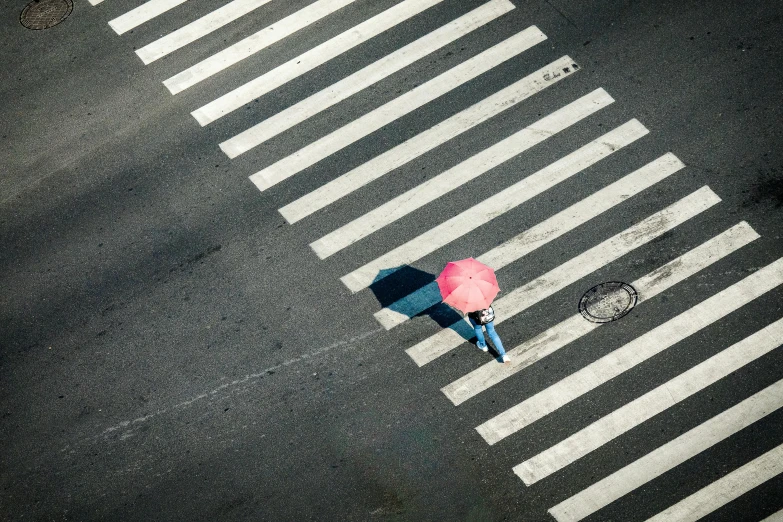 a person walking across a crosswalk with an umbrella, by Yasushi Sugiyama, fuchsia and blue, birdseye view, square lines, lonely