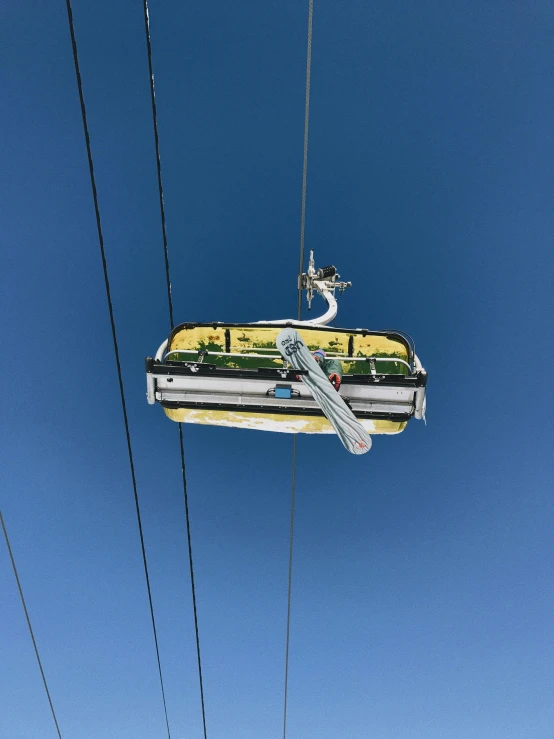 a ski lift going up to the top of a mountain, profile image