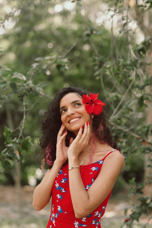 a woman in a red dress talking on a cell phone, flower in her hair, fernanda suarez, promo image, puerto rico