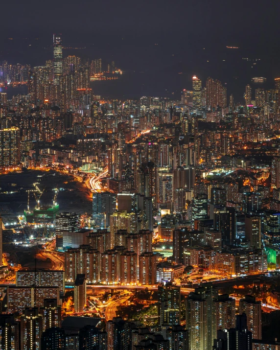 an aerial view of a city at night, pexels contest winner, a still of kowloon, panoramic, ilustration, stacked image