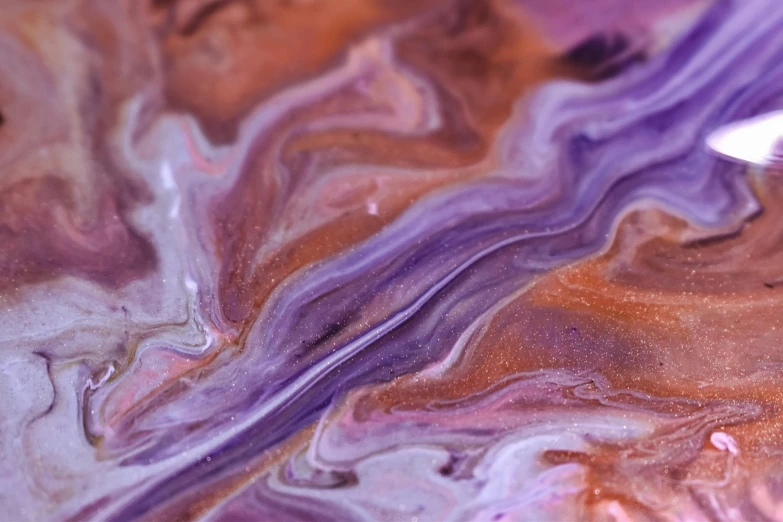 a pair of scissors sitting on top of a piece of paper, an ultrafine detailed painting, trending on pexels, process art, purple nebula, shiny layered geological strata, mocha swirl color scheme, acrylic paint pour