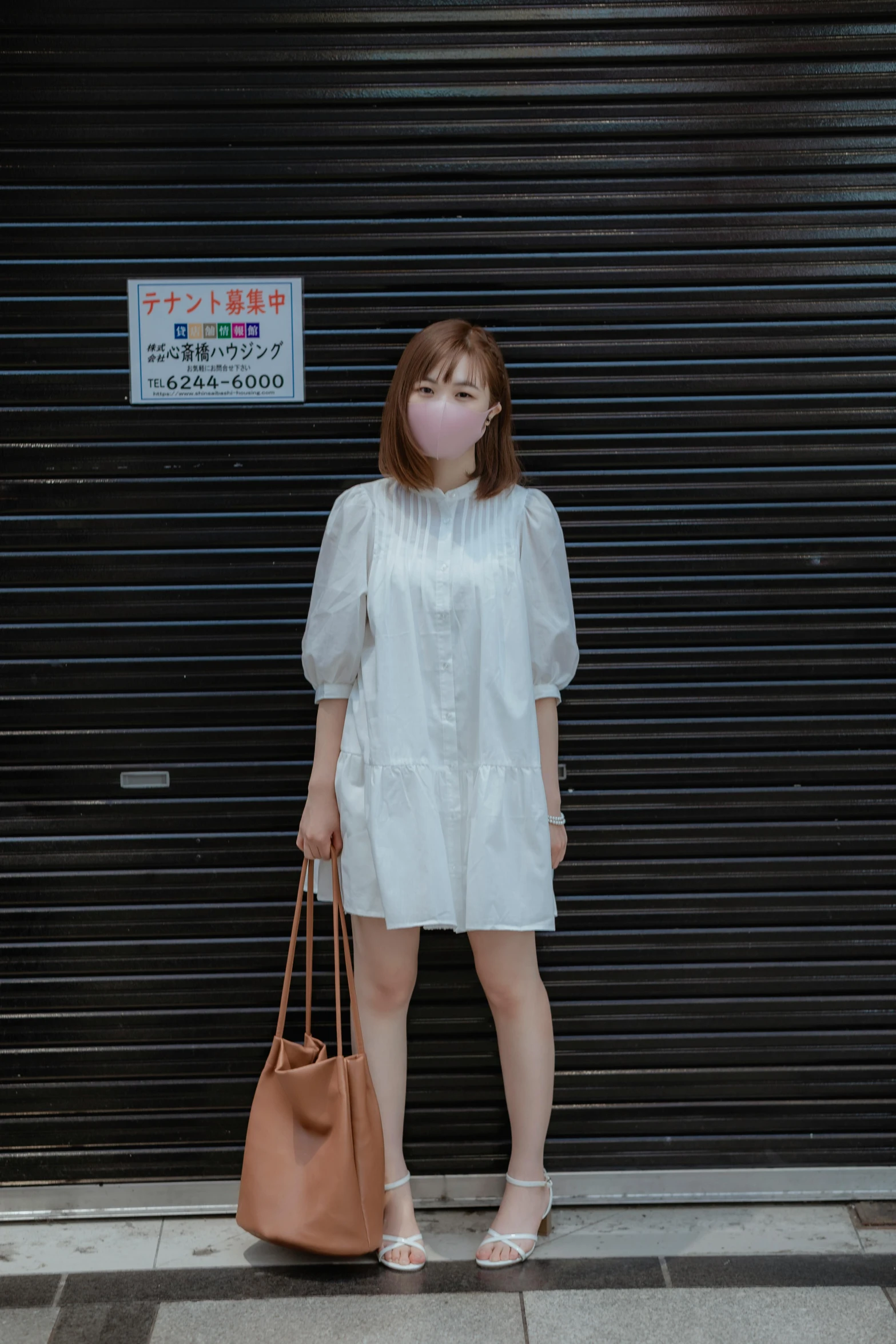 a woman standing in front of a garage door, a picture, by Sengai, unsplash, tachisme, wearing a cute white dress, けもの, white mask, 2263539546]