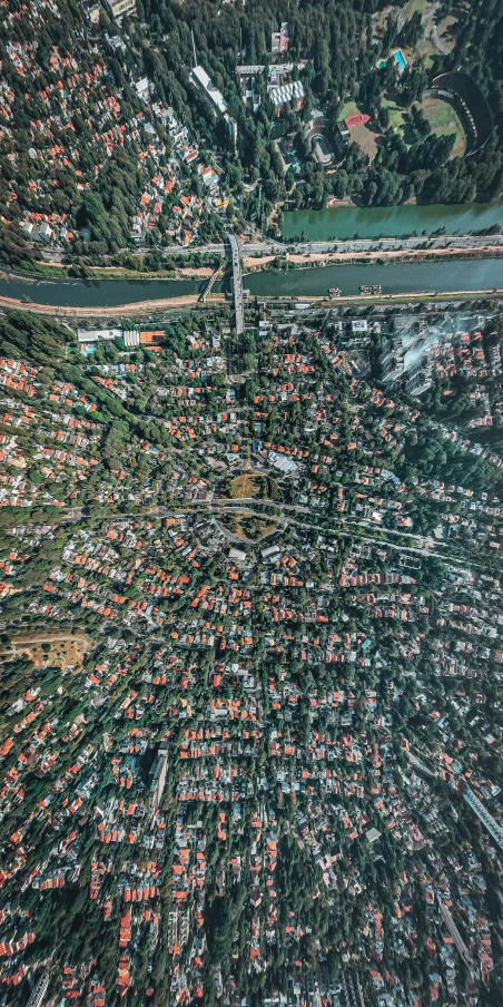 an aerial view of a city with lots of buildings, by Adam Marczyński, pexels, dutch angle from space view, suburban neighborhood, wide angle shot 4 k hdr, instagram post