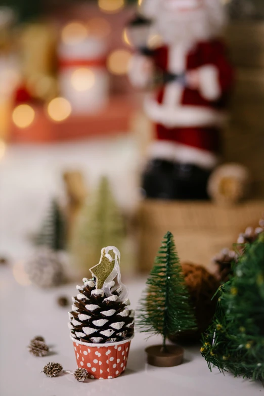 a small pine cone sitting on top of a table, a tilt shift photo, trending on pexels, santa inside a rustic barn, cosy enchanted scene, with trees, small crown