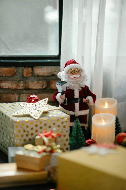 a christmas scene with presents and a santa clause figurine, pexels, folk art, next to window, good lighting, gif, candles