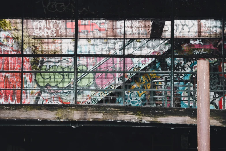 a red fire hydrant sitting in front of a graffiti covered wall, pexels contest winner, graffiti, look down a cellar staircase, space seen outside from a window, stood in a factory, multi - coloured