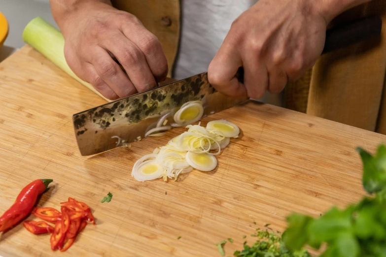 a person cutting an egg on a cutting board, marsden, fan favorite, rectangle, salad