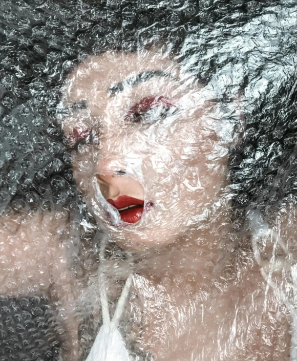 a close up of a person with water on their face, an album cover, inspired by Hedi Xandt, pexels contest winner, plastic wrap, asian human, icey, full view of face and body