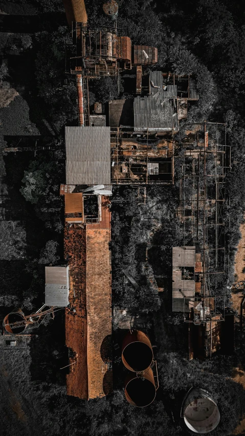 a group of pipes sitting next to each other, by Lee Loughridge, pexels contest winner, assemblage, satellite view, dark ruins, structure : kyle lambert, city buildings on top of trees