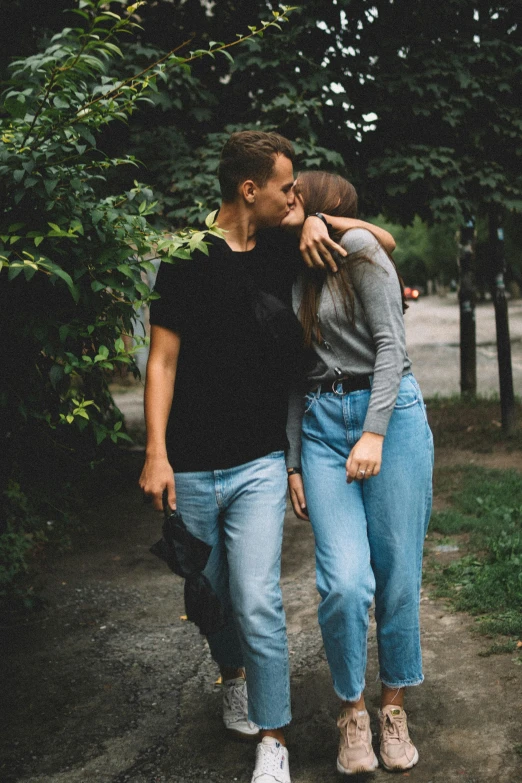 a man and a woman standing next to each other, trending on pexels, russian girlfriend, wearing pants, kissing, 15081959 21121991 01012000 4k