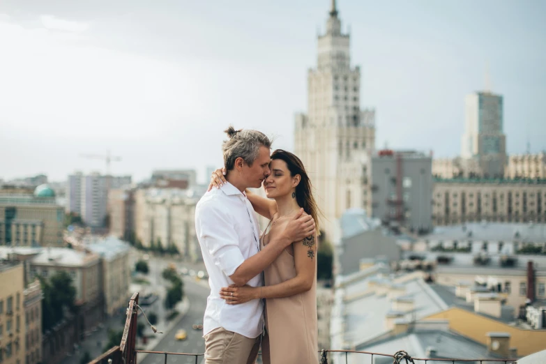 a man and a woman standing on top of a building, by Emma Andijewska, pexels contest winner, neo-romanticism, moskvich, square, 15081959 21121991 01012000 4k, medium head to shoulder shot