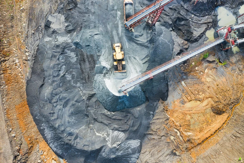 an aerial view of a construction site in a quarry, pexels contest winner, coal dust, thumbnail, embedded with gemstones, black