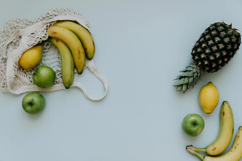 a bunch of fruit sitting on top of a table, trending on pexels, background image, profile image, product shot, some yellow green and blue