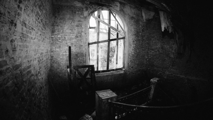 a black and white photo of a window in a building, post apocalyptic palace interior, taken in the 2000s, stairs to the second floor, brick