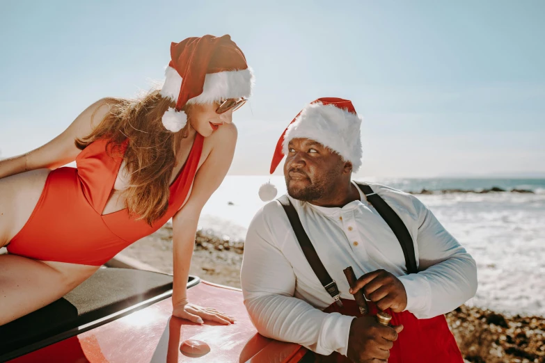 a woman sitting on top of a red car next to a man in a santa hat, pexels contest winner, renaissance, shaq, plus-sized, near the beach, profile image