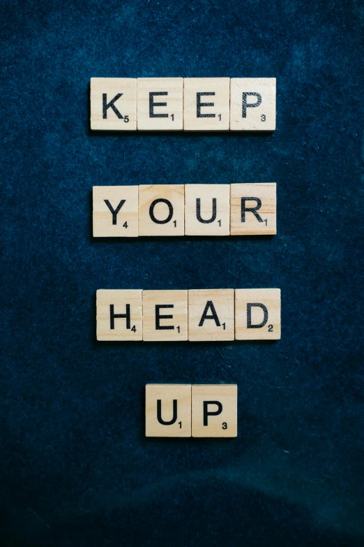 scrabbles spelling keep your head up on a blue background, an album cover, by Jesper Knudsen, unsplash, happening, portrait n - 9, business, bedhead, covid