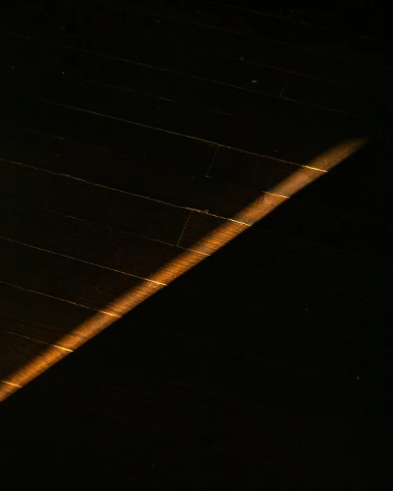 a plane is flying through the night sky, an album cover, by Attila Meszlenyi, unsplash, light and space, sun puddle, black floor, diagonal lines, taken in the late 2000s