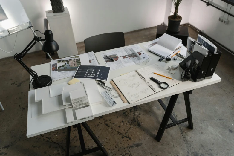 a table that has a bunch of papers on it, a computer rendering, pexels contest winner, hyperrealism, norman foster, character sheets on table, white wall coloured workshop, urban planning