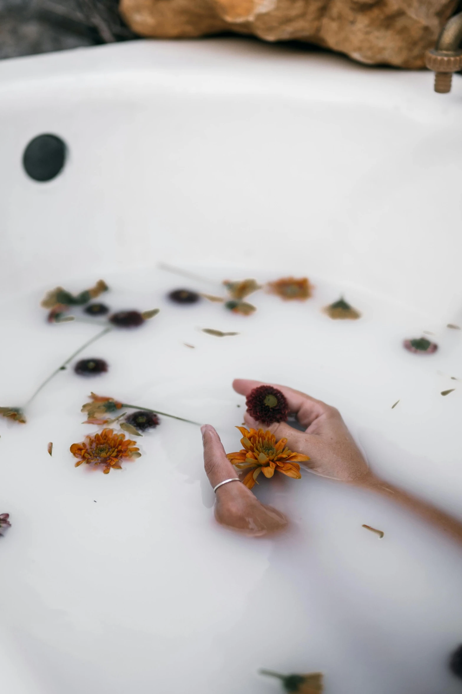 a person taking a bath with flowers in a tub, trending on unsplash, process art, floating objects, autum, on a white table, atmospheric”