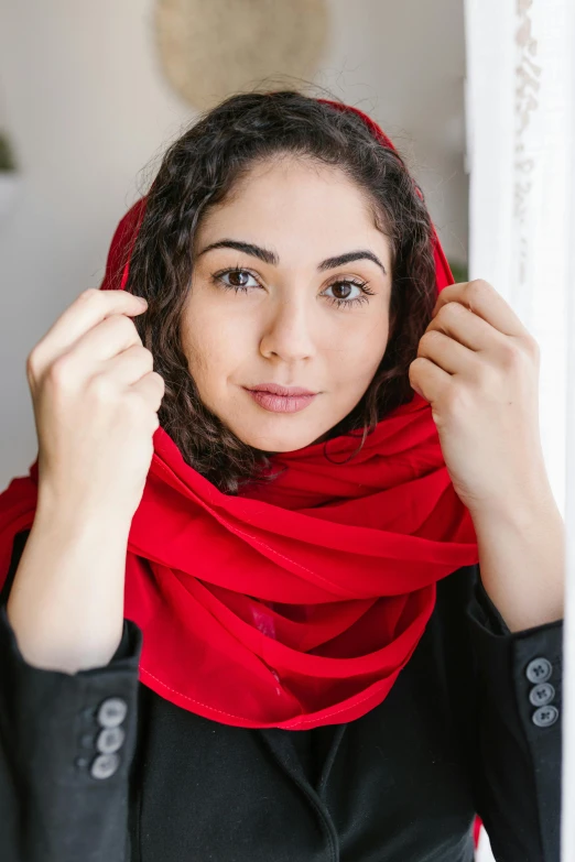 a woman in a black shirt and a red scarf, inspired by Maryam Hashemi, pexels contest winner, pale-skinned persian girl, wearing a red outfit, product introduction photo, casually dressed