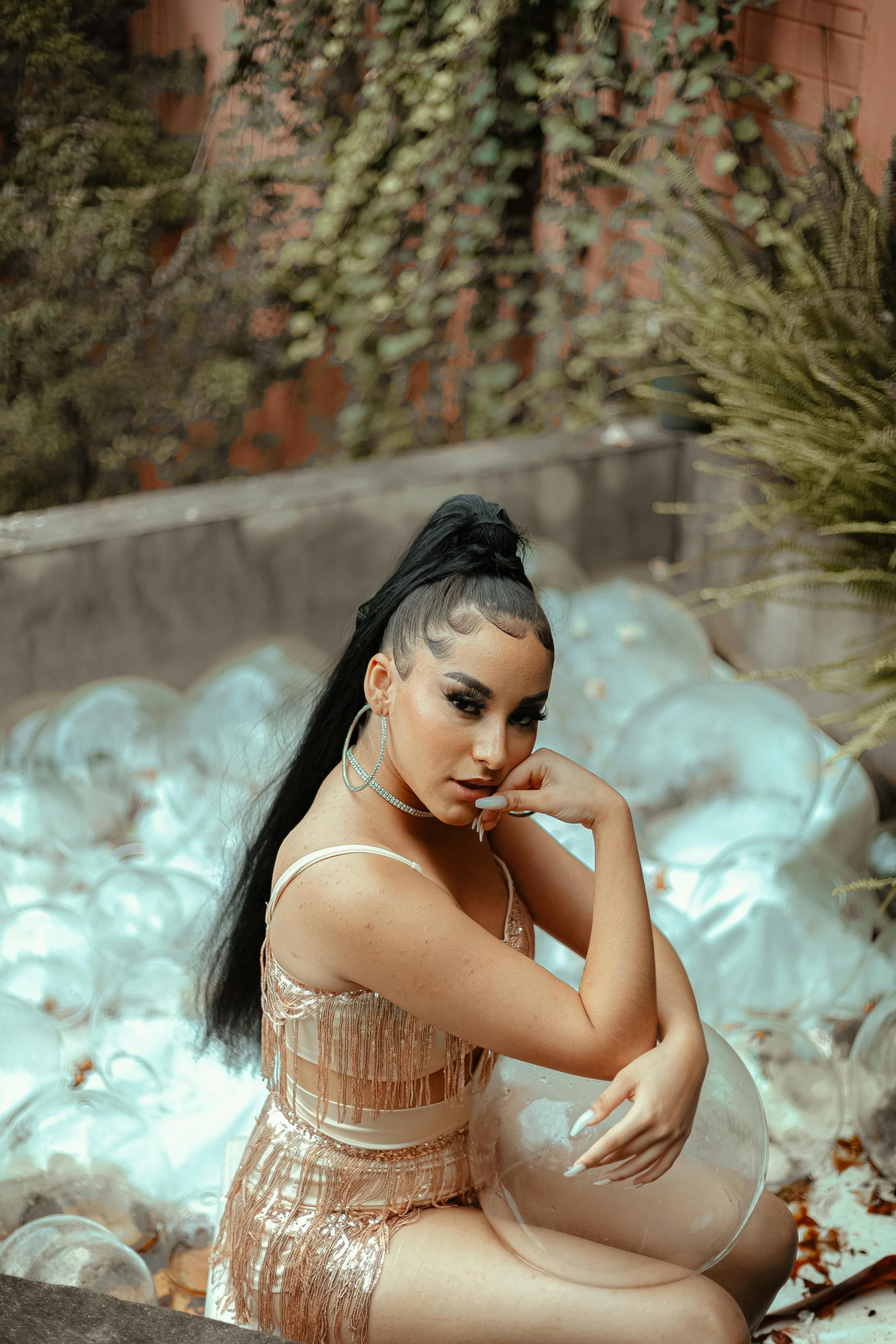 a woman sitting in a pool of water, an album cover, inspired by Gina Pellón, trending on pexels, ponytail black hair, arab princess, cl, casual pose