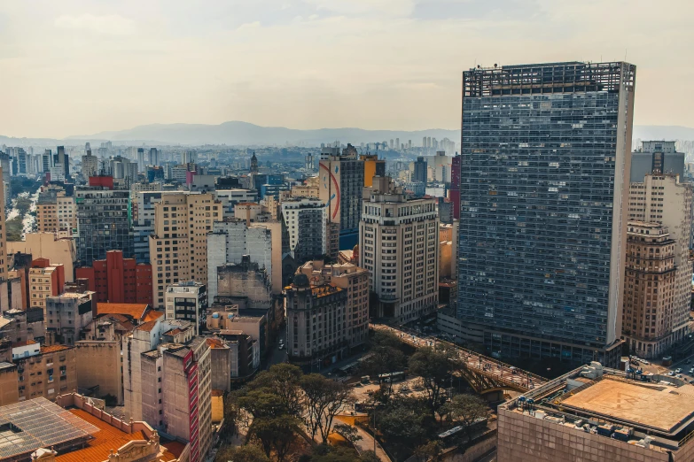 a view of a city from the top of a building, by Ceferí Olivé, fan favorite, group photo, panoramic