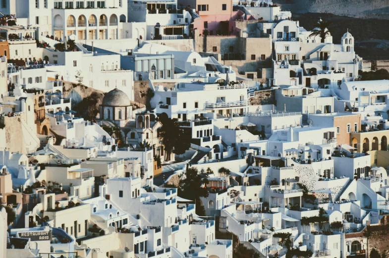 a group of white buildings sitting on top of a hill, a colorized photo, pexels contest winner, hyperrealism, greek fabric, brown, grey, white