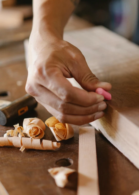 a person is working on a piece of wood, a portrait, trending on unsplash, arts and crafts movement, thumbnail, gourmet and crafts, long, tiffany dover