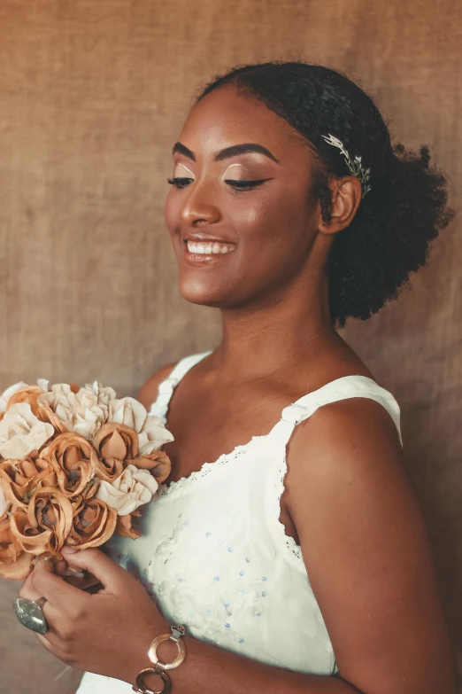 a woman in a wedding dress holding a bouquet, by Quinton Hoover, with afro, ivory and copper, mini model, front closeup