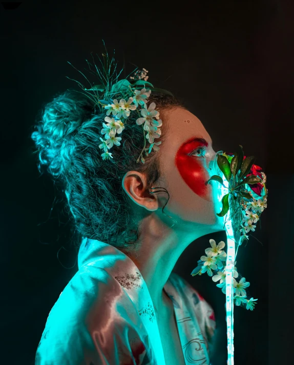 a woman with a flower in her mouth, an album cover, inspired by Elsa Bleda, pexels contest winner, blue and red lights, humanoid flora, concert photo, the non-binary deity of spring